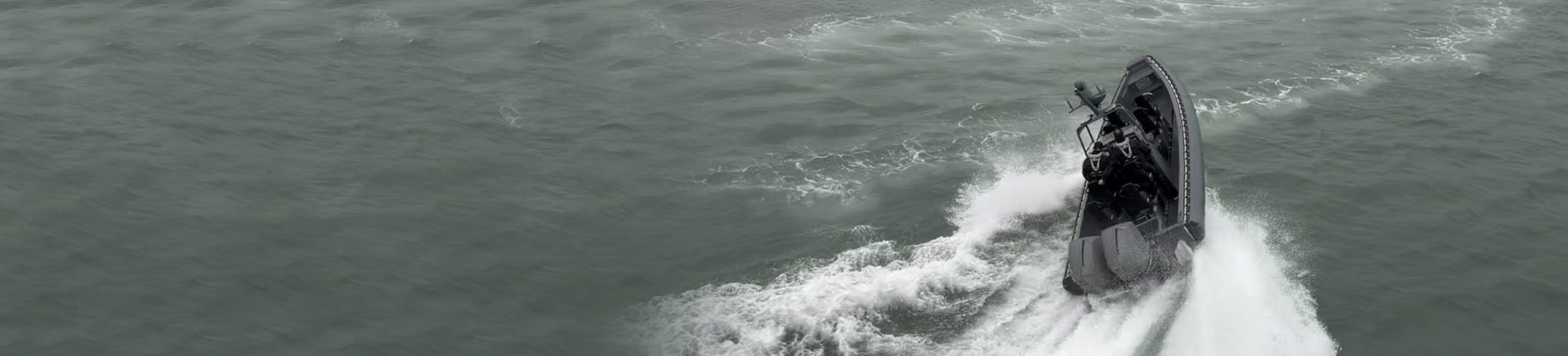 RIB turning at speed with wake, typical of the UK marine trade we support